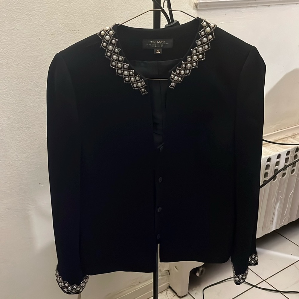 Gorgeous two piece black skirt suit.  Beading around the neckline and cuffs.
